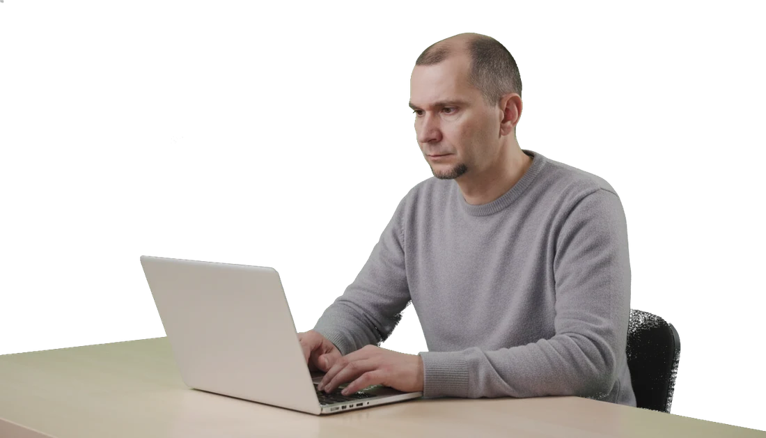 Andrei at the laptop, deep in a problem.